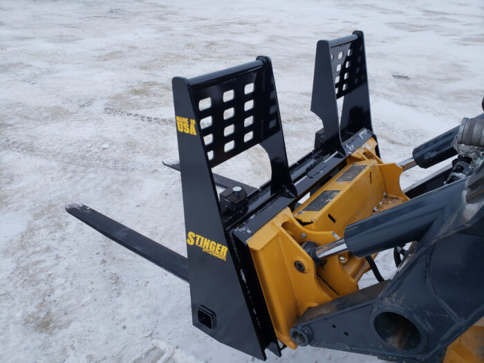 Side of forklift with pallet fork attachment from Stinger Attachments