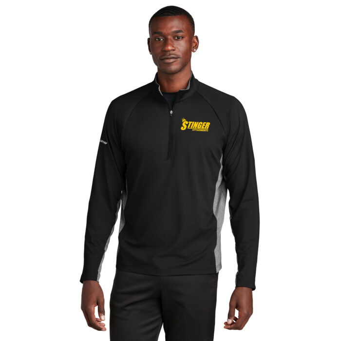 Man in black sport material quarter zip with yellow Stinger Attachments logo