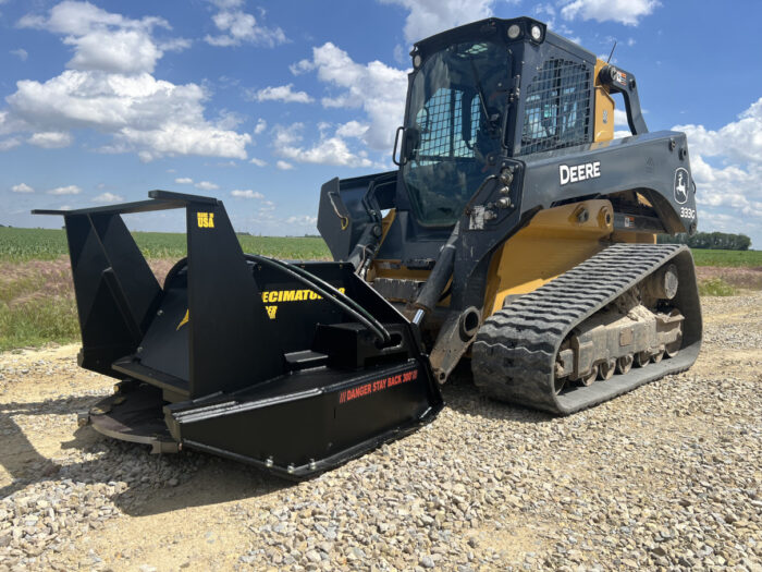 Close up of Yellow John Deere Bull Dozer with black Stinger Attachment decimator cover