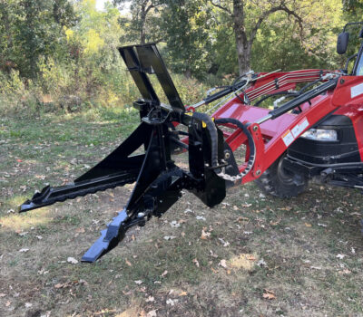 Red tractor with black v-shaped Stinger Attachment